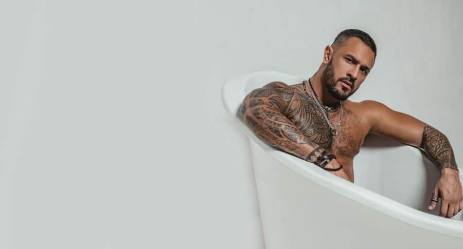 Tattooed Bearded Man In Bath