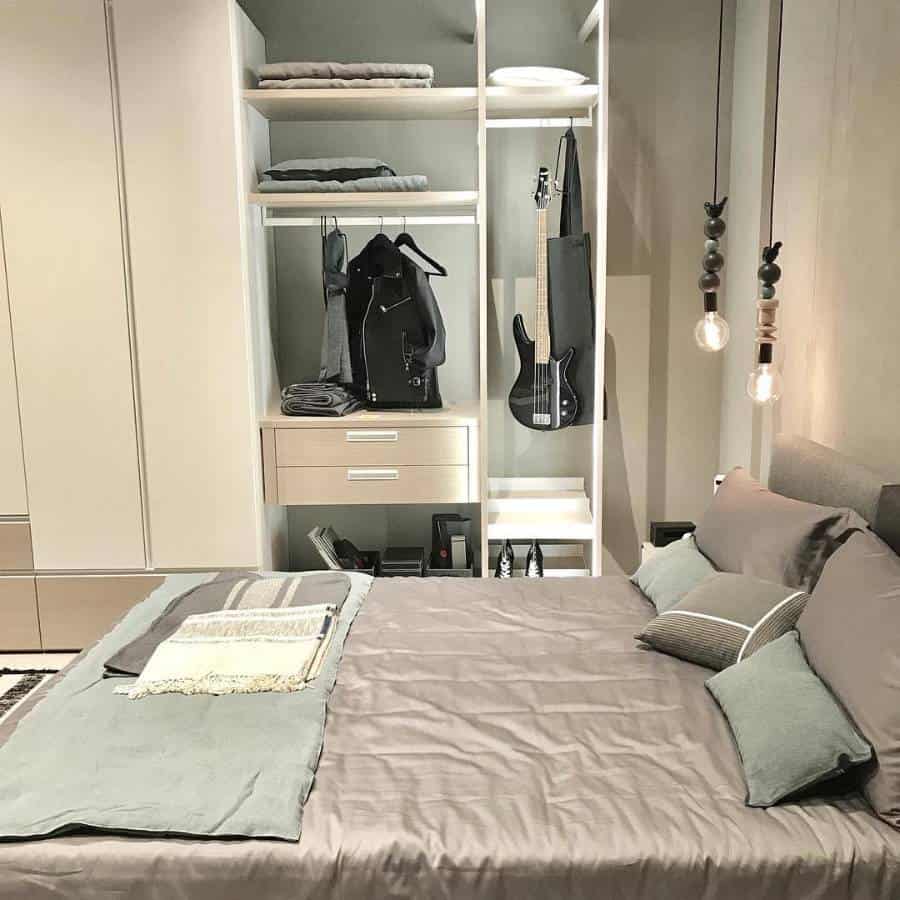 neutral modern bedroom with open cupboard 