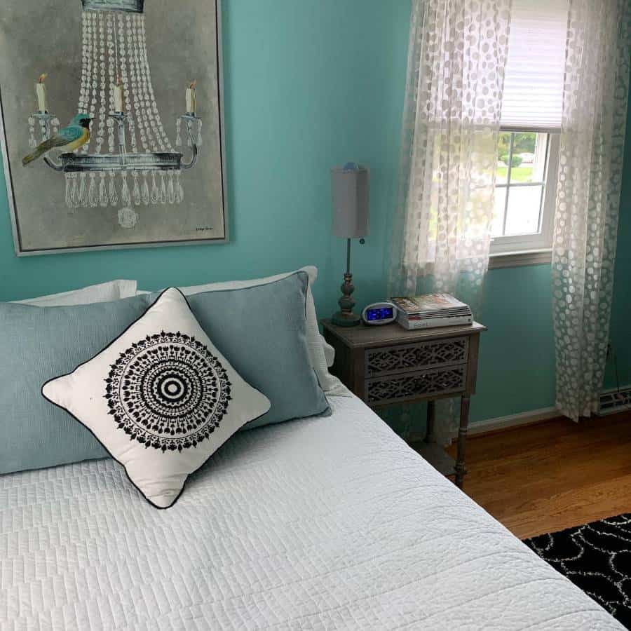guest spare bedroom with blue accent wall