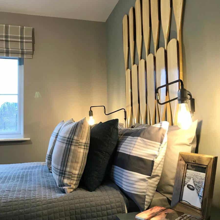 gray small master bedroom with oar headboard 
