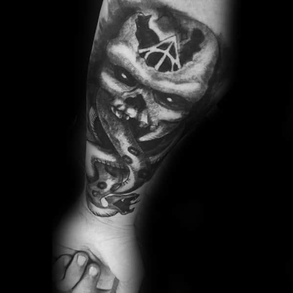 The Dark Mark Tattoos Male On Forearm With Heavily Shaded Design