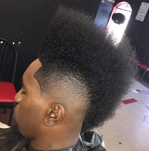 A classic frohawk featuring tall and textured hair on top, tapered sides, and clean hairline