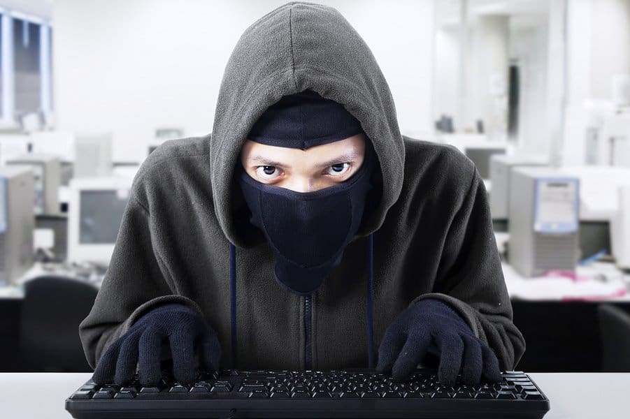 thief stealing data from computer