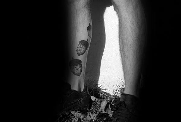 Three Acorns On Mans Leg Tattoo Ideas