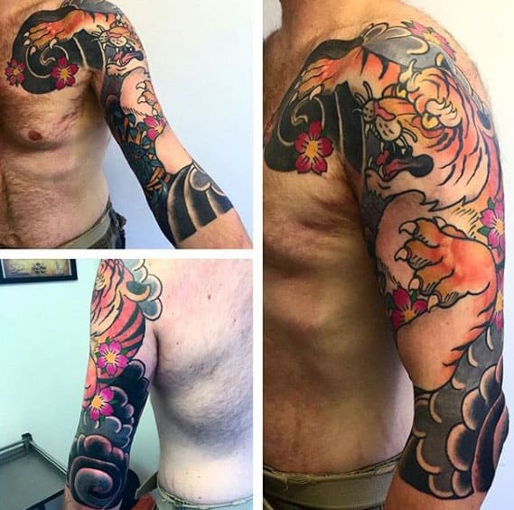 Tiger With Clouds Mens Traditional Japanese Half Sleeve Tattoos