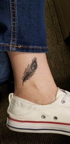 Tiny Ankle Peacock Feather Tattoo