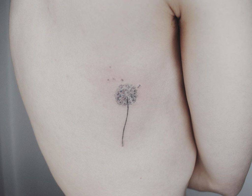 tiny black dandelion tattoo