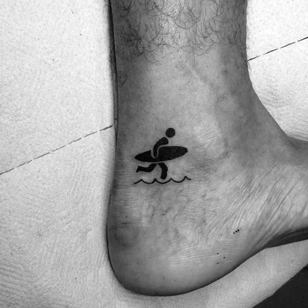 Tiny Man And Surf Board Tattoo Male Ankles