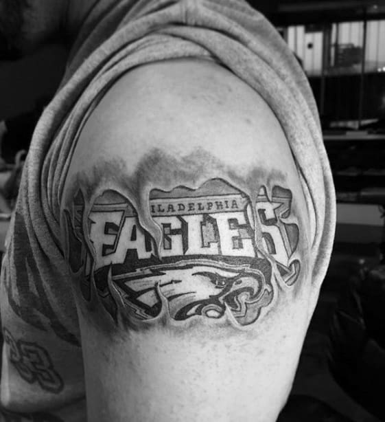 Torn Skin Philiadephia Eagles Logo Male Arm Tattoos