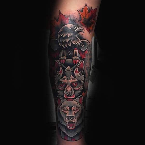 totem-pole-of-animals-maple-leaf-guys-forearm-sleeve-tattoo