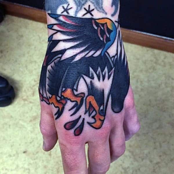 traditional-american-annoyed-dark-raven-tattoo-guys-hands