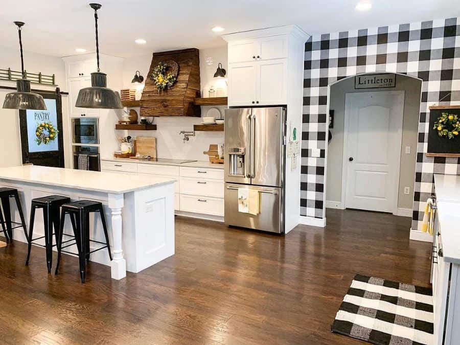 traditional country kitchen white cabinets black stools and check feature wall