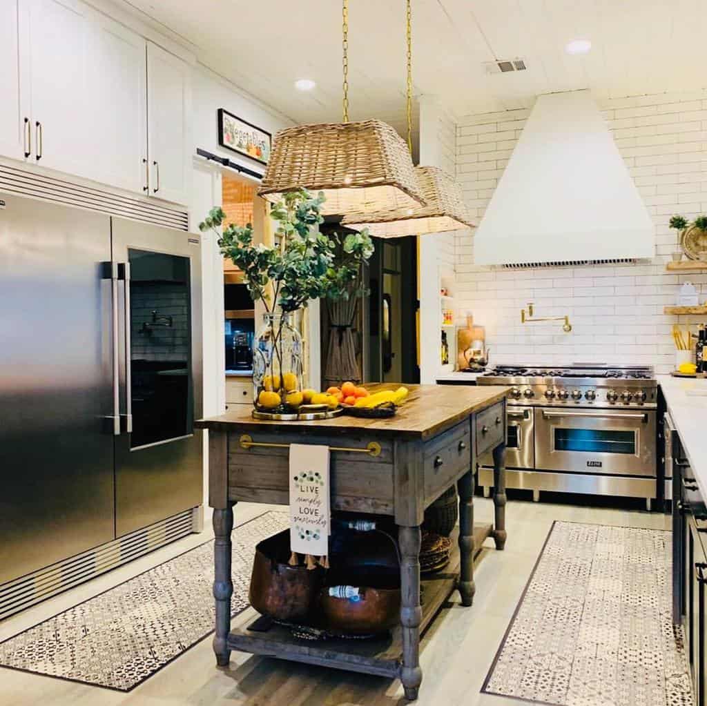 modern farmhouse kitchen white cabinets gray wood island with drawers white brick splashback wall