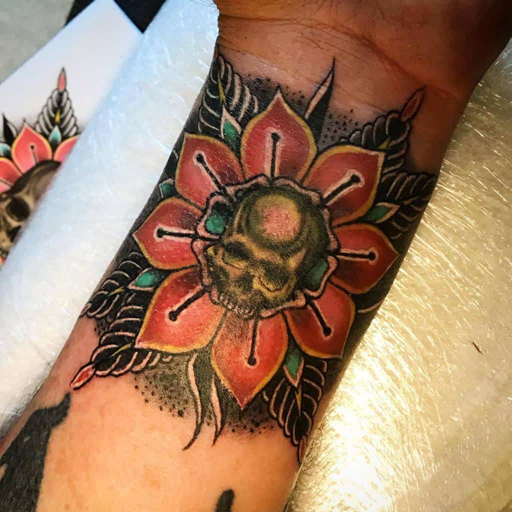 traditional flower wrist tattoo lightcaptattoo