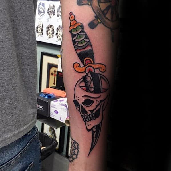 Traditional Forearm Skull With Dagger Tattoo Ideas For Men