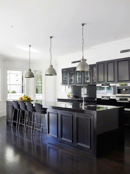 long kitchen island black cabinets silver pendant lights 