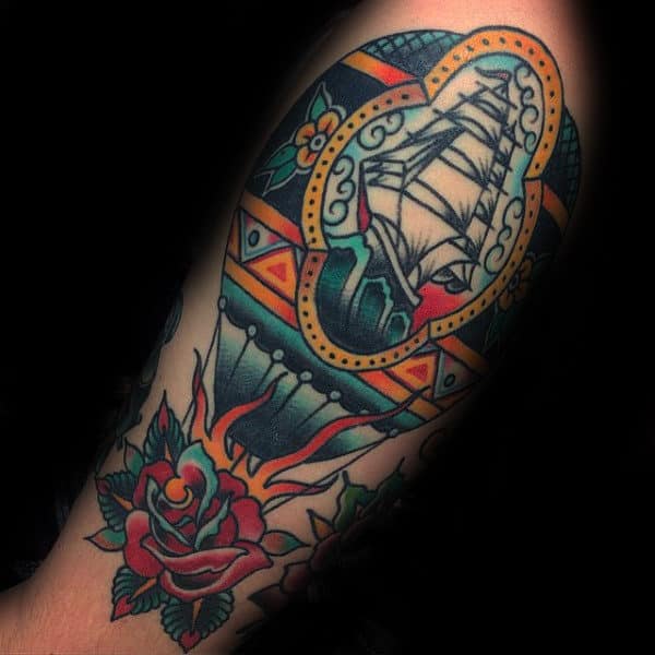 Traditional Hot Air Balloon Tattoo On Man With Sailing Ship And Rose Flower