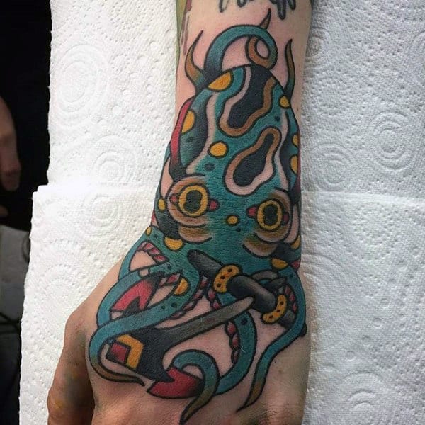 Traditional Octopus With Anchor Mens Hand And Wrist Tattoo Designs