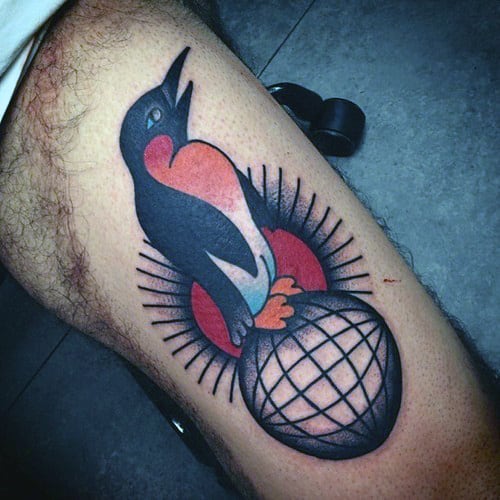 Traditional Penguin Standing On Globe Mens Thigh Tattoos
