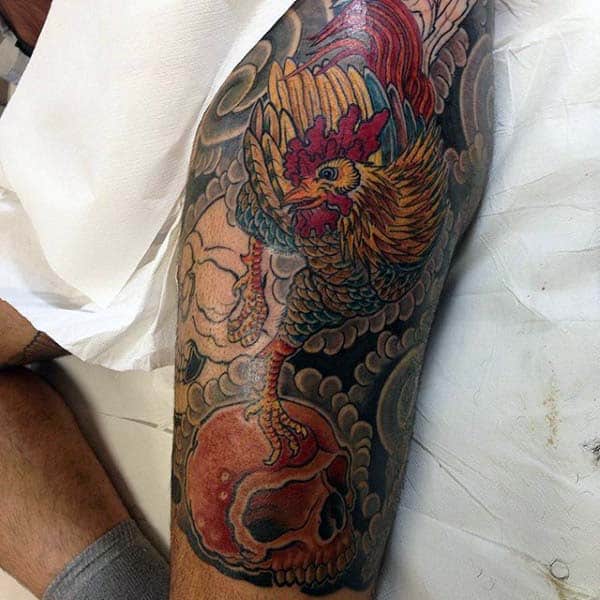 Traditional Style Rooster Tattoo For Men With Skull On Thigh