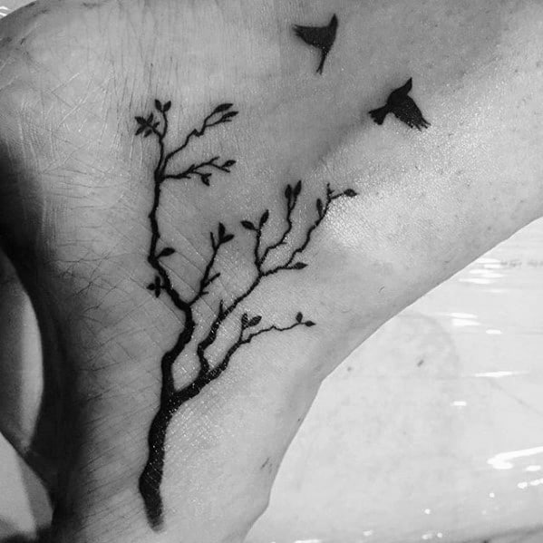Tree Branches With Two Birds Flying Ankle Tattoo Design Ideas For Males