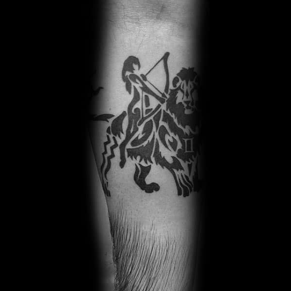 Tribal Sagittarius Male Forearm Tattoo In Black Ink