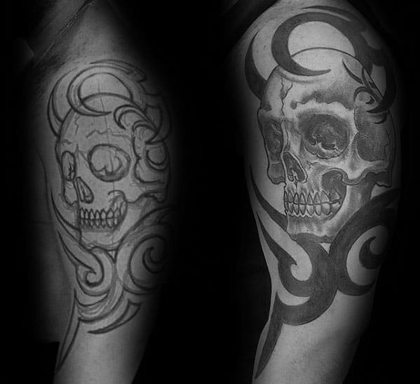 tribal skull arm tattoo