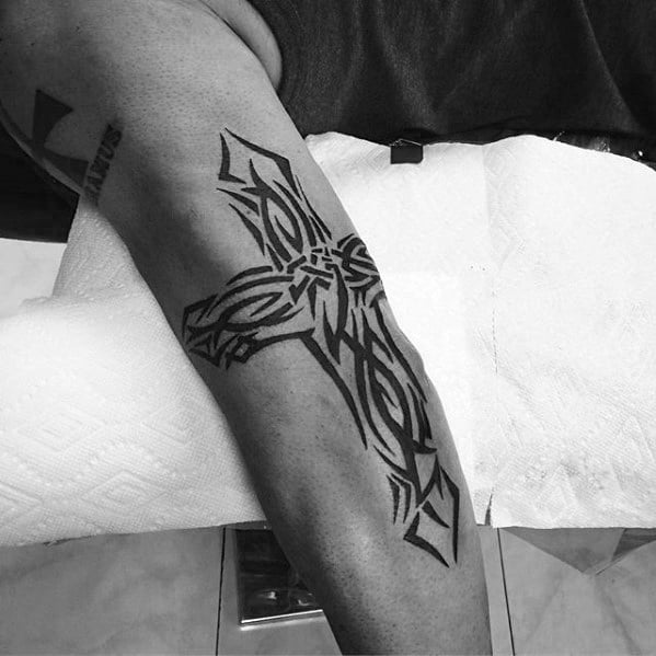 Tribal Small Religious Cross Mens Outer Arm Tattoo