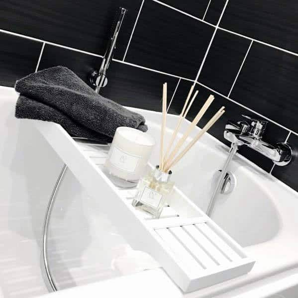 black bathroom with white fixtures 