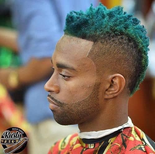 Bold frohawk style with top hair dyed in turquoise green and paired with beard