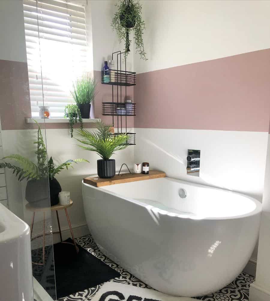 two tone white and pink wall vintage bathroom with free standing tub