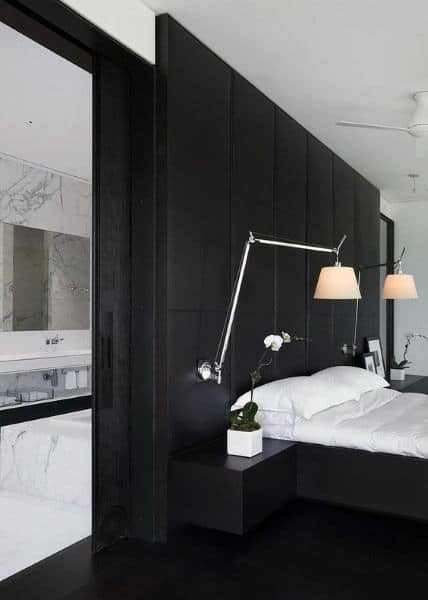 modern black and white bedroom large black headboard marble bathroom