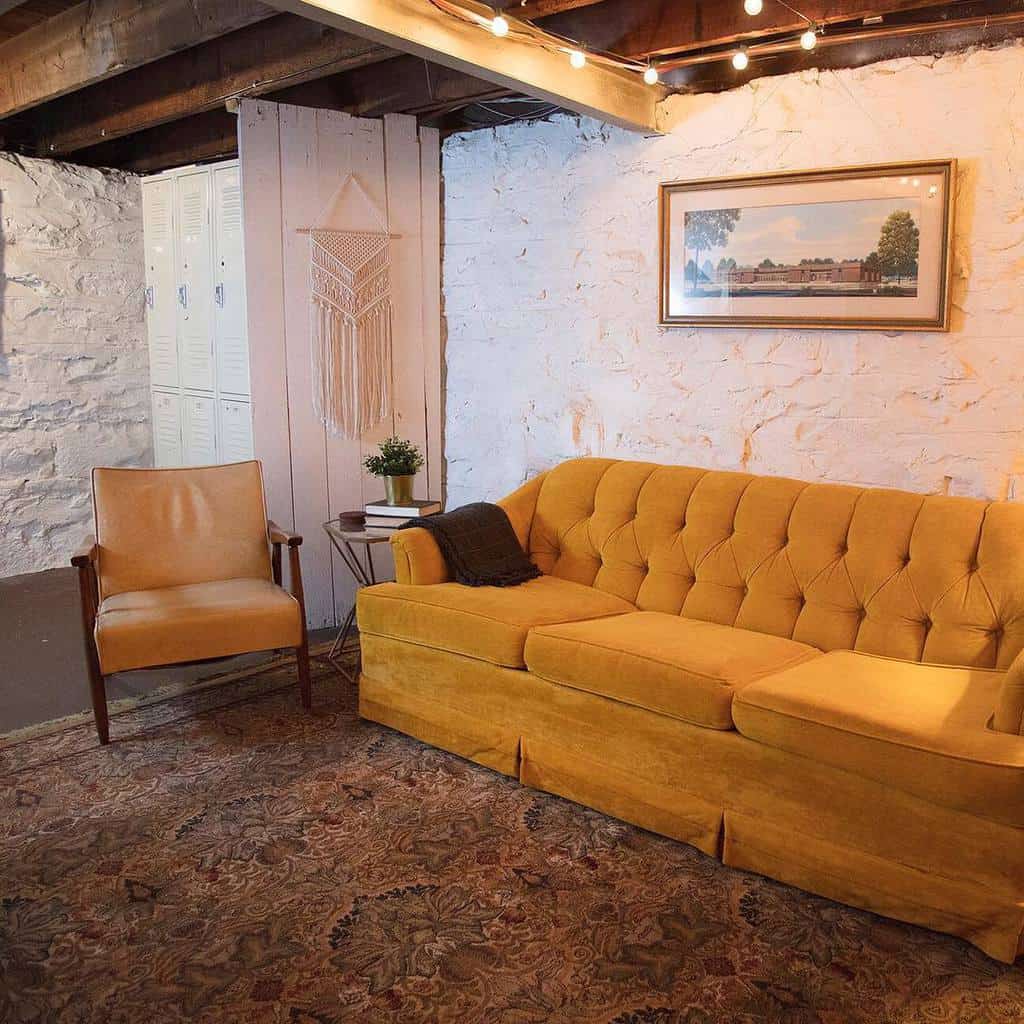 mustard couch in rustic living room