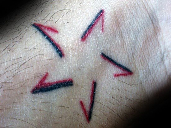 Unique Black And Red Ink Negative Space Simple Star Tattoos For Guys On Wrist