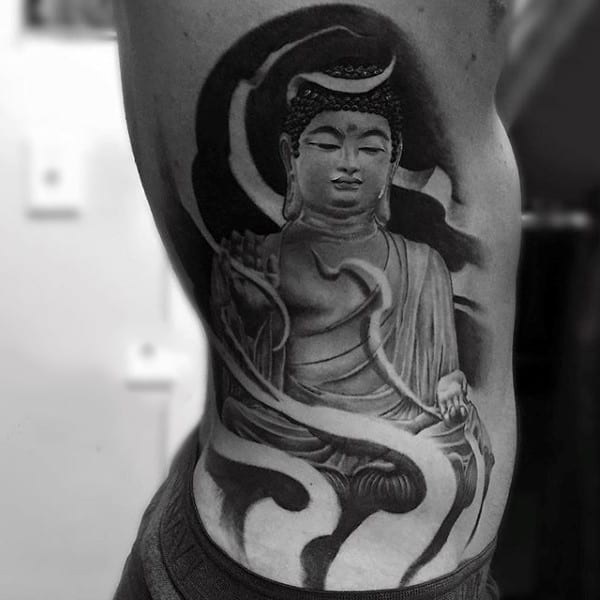 Unique Buddha And Swirls Tattoo On Ribs For Men