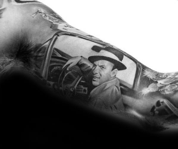 Black and grey Frank Sinatra portrait tattoo located on