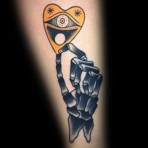 Unique Mens Skeleton Hand Holding Planchette Tattoos On Forearm