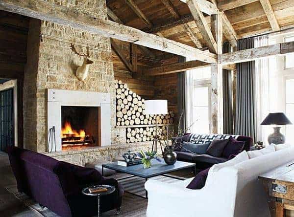 rustic living room exposed wood beams fireplace purple sofa 