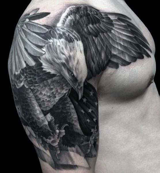 Upper Arm American Flag And Eagle Tattoo On Male