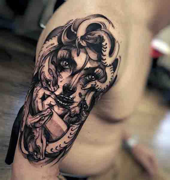 Upper Arm Medusa Tattoo In Black Ink For Males