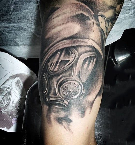 Upper Arm Mens Bicep Gas Mask Tattoo In Black Shaded Ink