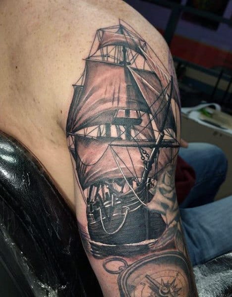 Upper Arm Ship With Compass Nautical Tattoo On Male