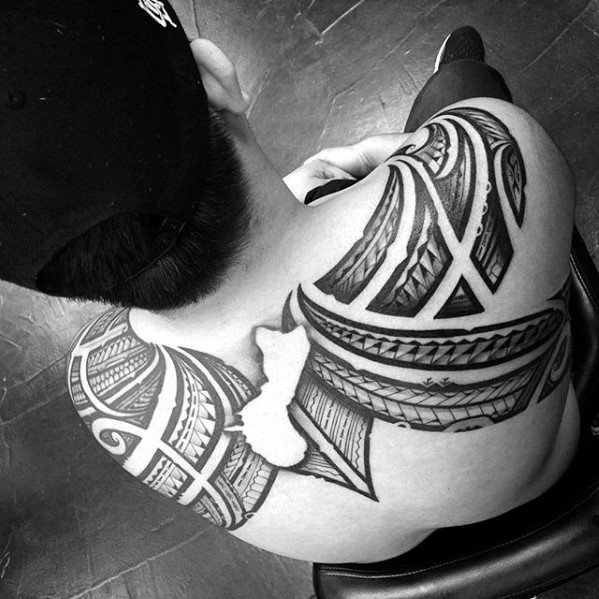 Upper Back Negative Space Polynesian Male Sick Tribal Tattoos