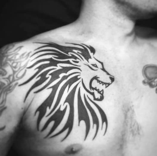 Upper Chest Black Ink Lion Animal Tribal Tattoo Design On Man