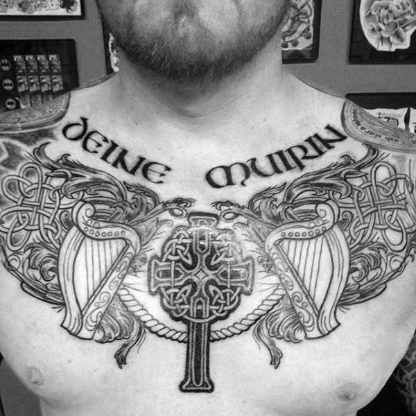 Upper Chest Irish Celtic Cross With Harp Tattoo On Guy