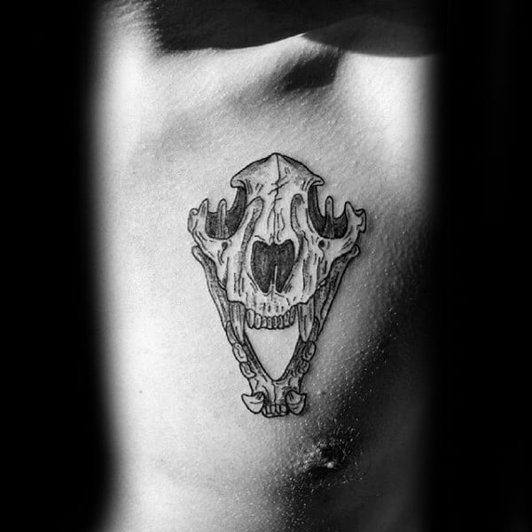 Upper Chest Wolf Skull Tattoo On Guy