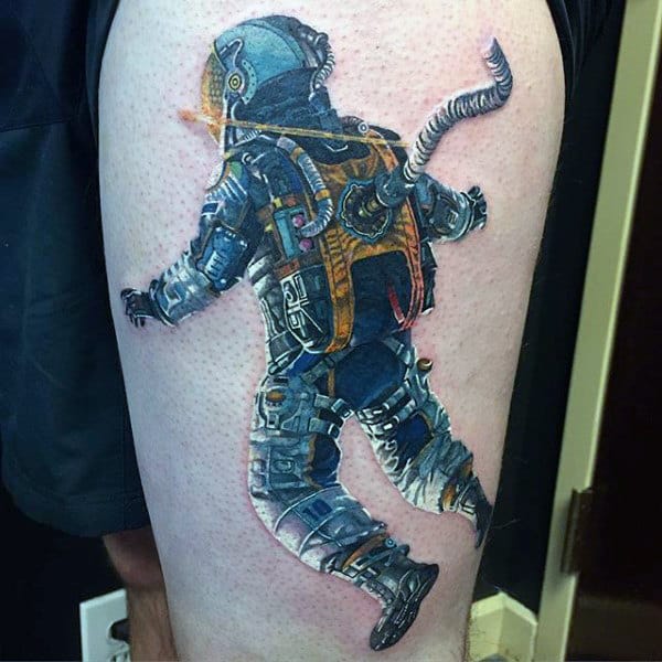 Upper Thigh Tattoo Of Floating Astronaut For Males