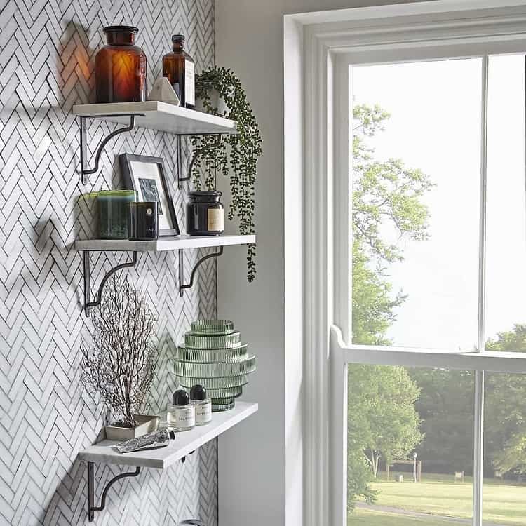white bathroom shelves with window view