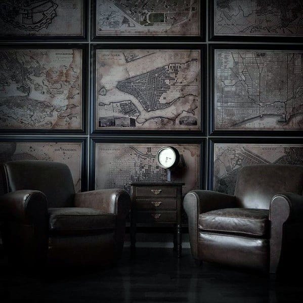 vintage style living room with leather armchairs and framed wall map art