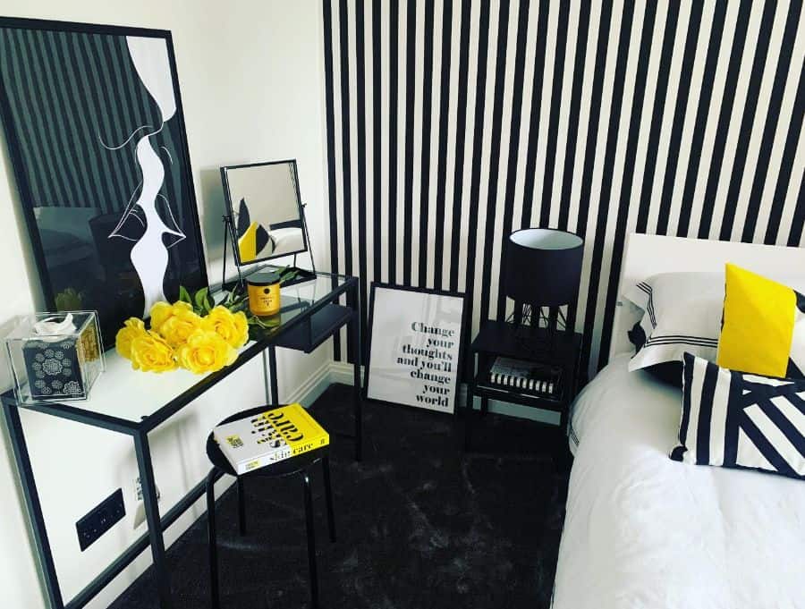 black and white striped wall small bedroom yellow flowers